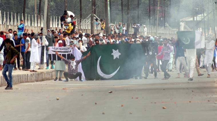 Kashmiri youth raise Pakistani flag in valley as part of New Year celebrations