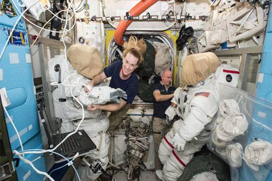 US astronauts begin spacewalk to install new parking spot