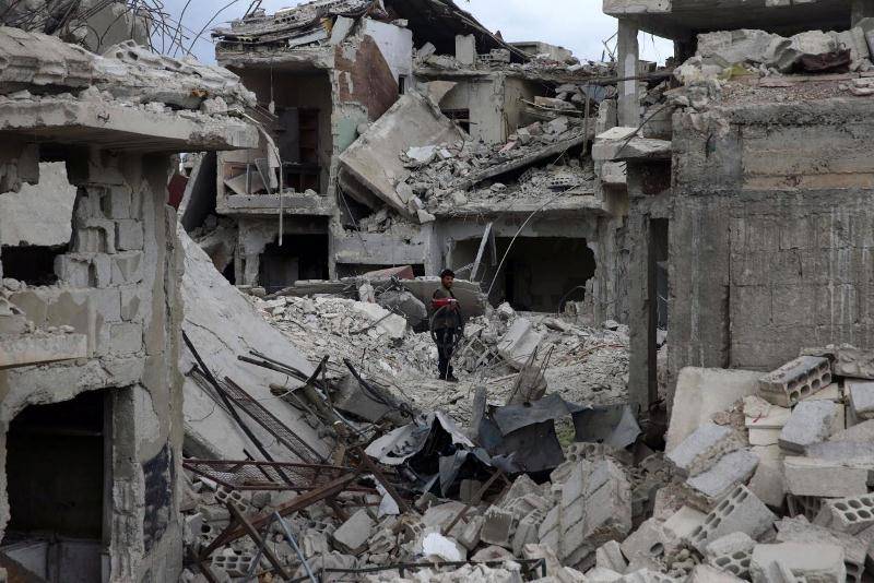 Rebels say Syrian forces dropped chemicals on Douma, government denies accusation