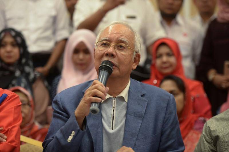 Police raids flats linked with ousted PM Najib Razak in Malaysia