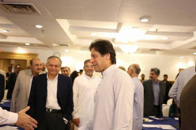 Imran arrives in Karachi, meets business delegation