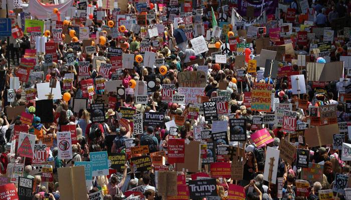 Tens of thousands of people protest in London over Donald Trump arrival