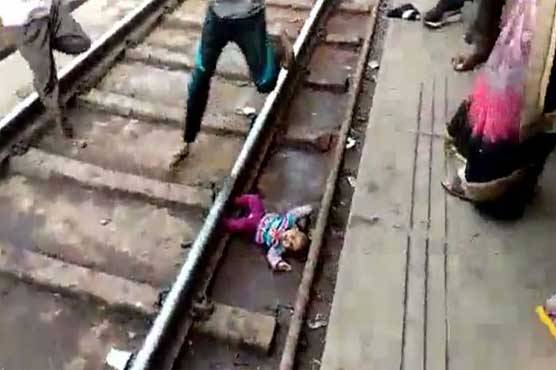 Indian baby survives after being run over by train