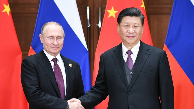 Chinese and Russian leaders meet, agree to upgrade relations to strategic partnership