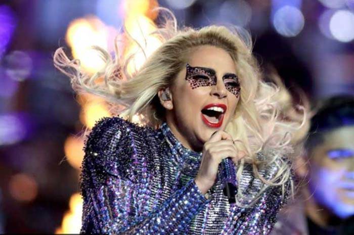 Singer Lady Gaga falls off the stage during live performance